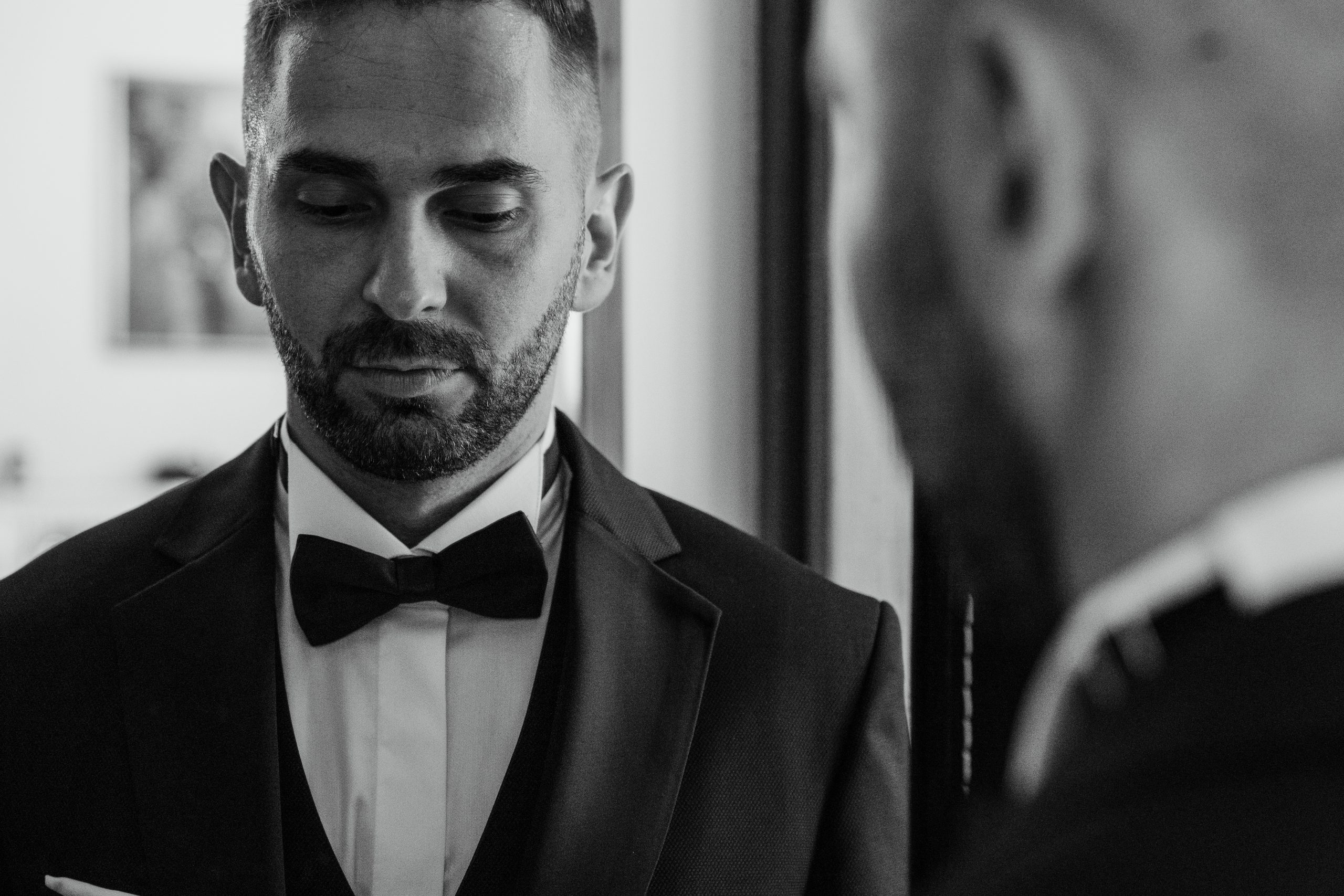 groom reflection in mirror