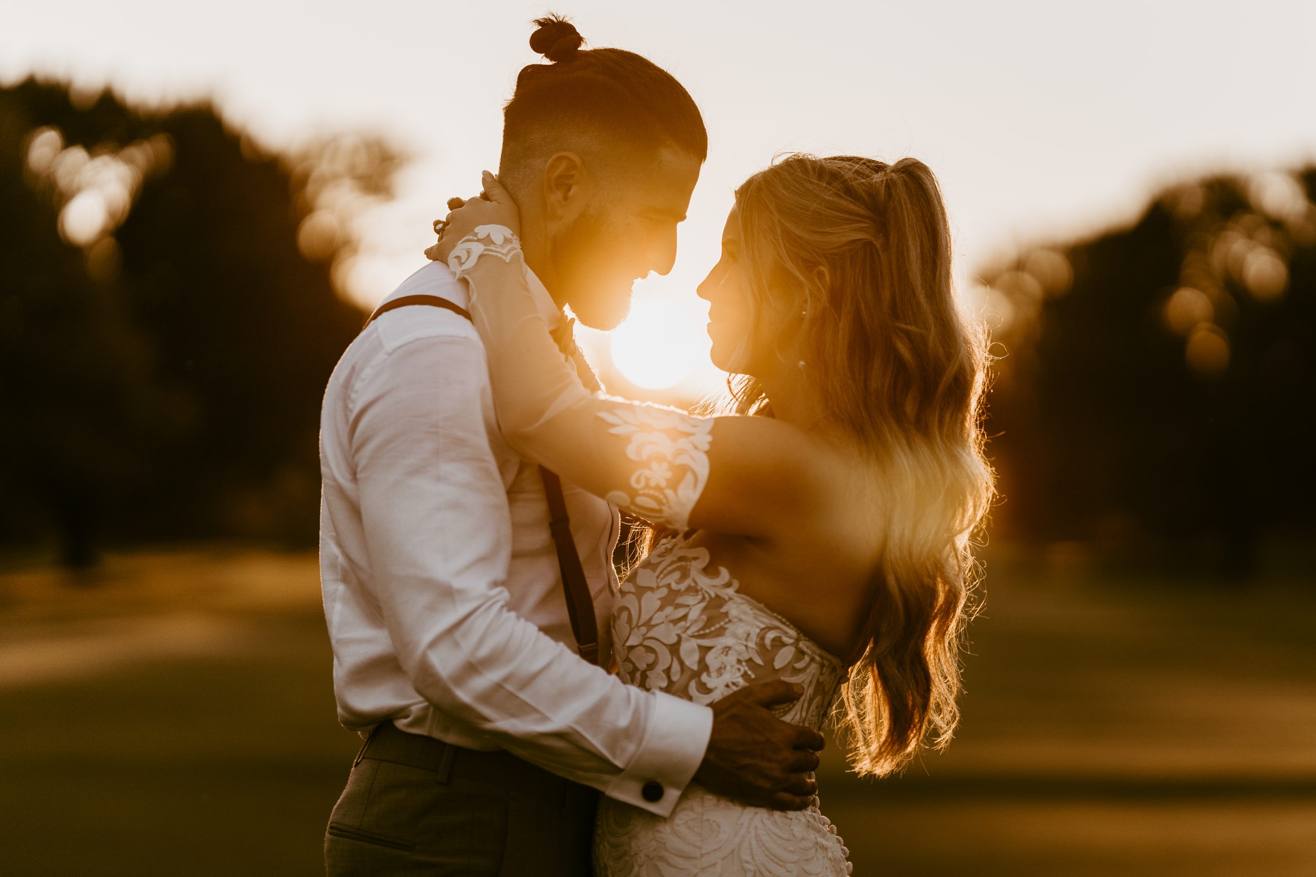golden hour image taken by a toronto wedding photographer of a bride and grooms silhouette