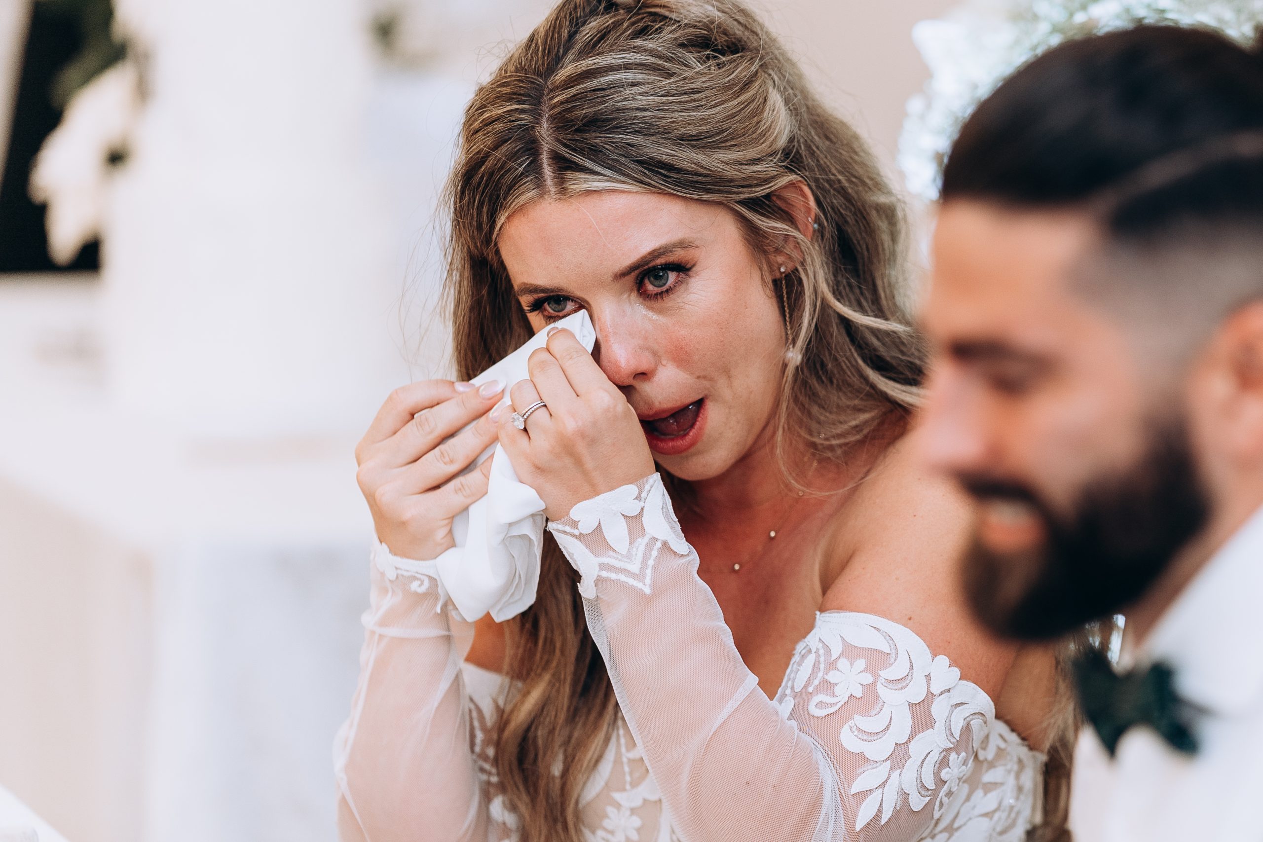 bride sheds a tear during a speech